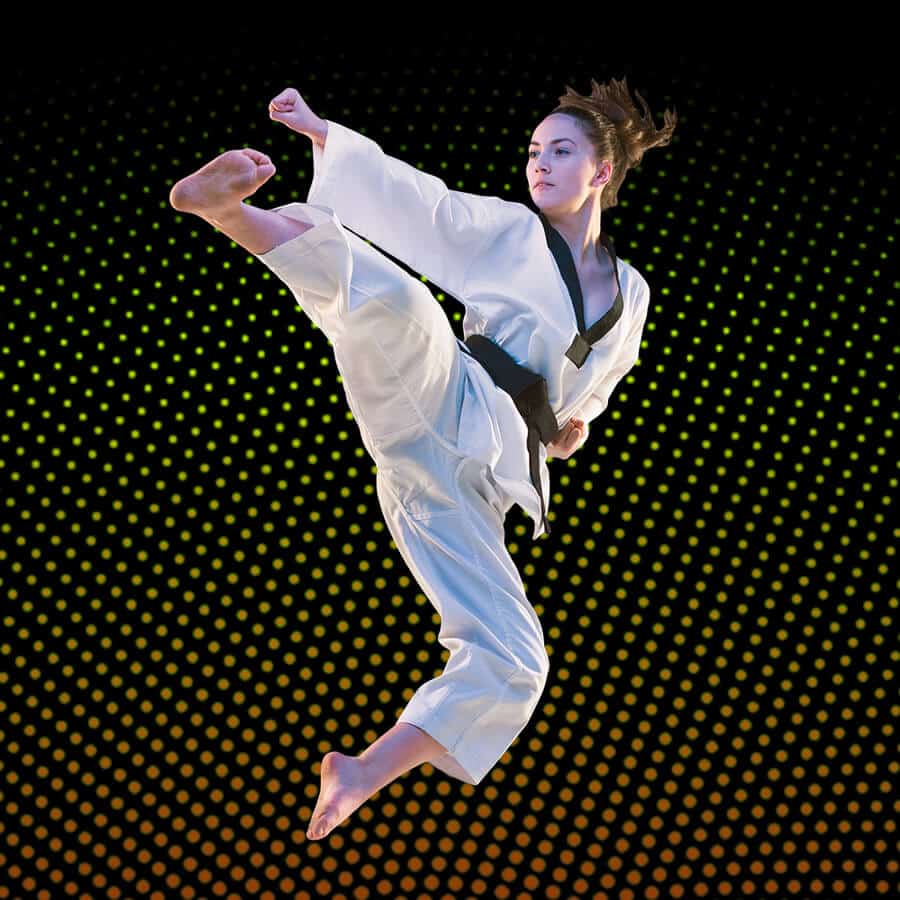 Martial Arts Lessons for Adults in Centreville VA - Girl Black Belt Jumping High Kick
