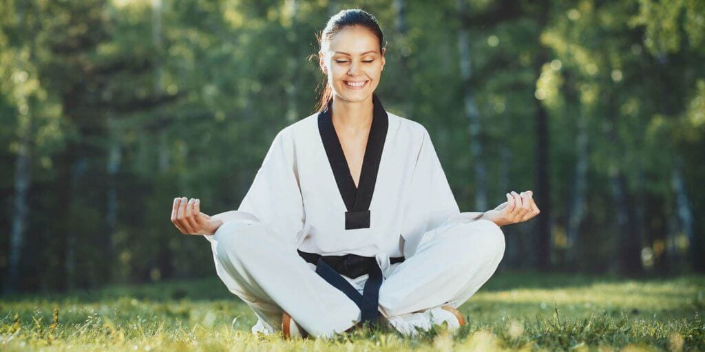Martial Arts Lessons for Adults in Centreville VA - Happy Woman Meditated Sitting Background